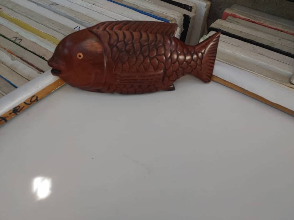 Hand-carved wooden fish ornament